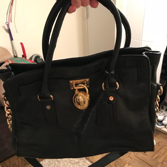 michael kors black purse with gold lock
